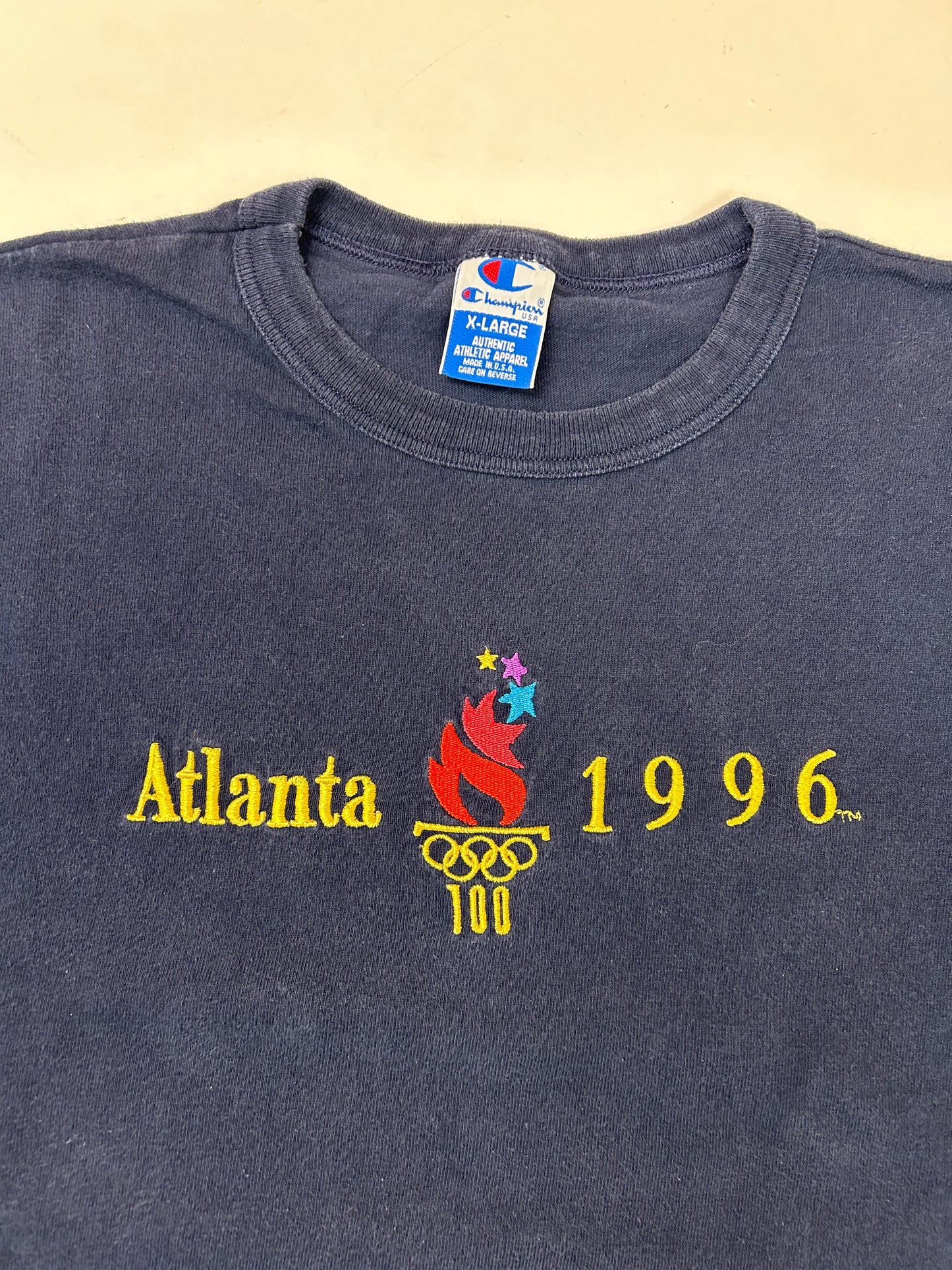 Vintage Champion 1996 Atalanta Olympics Embroidered Logo Tee Navy XL 24.25x28.5 Inches